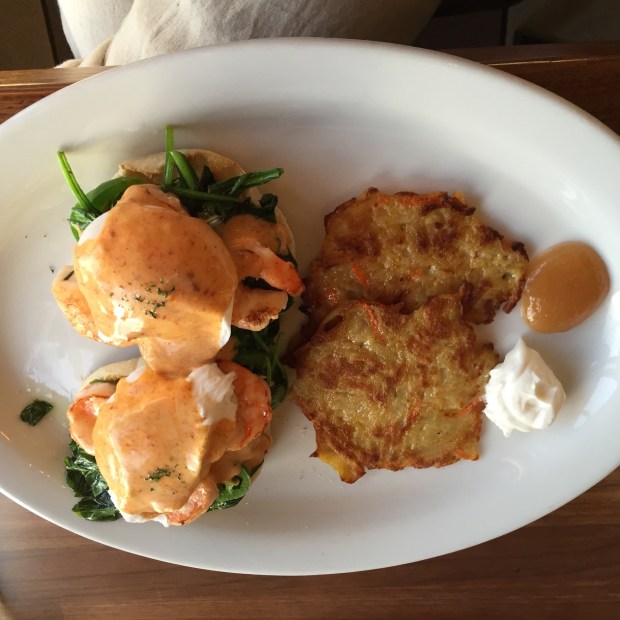 The Eggs Benedict served with carrot potato latkes 